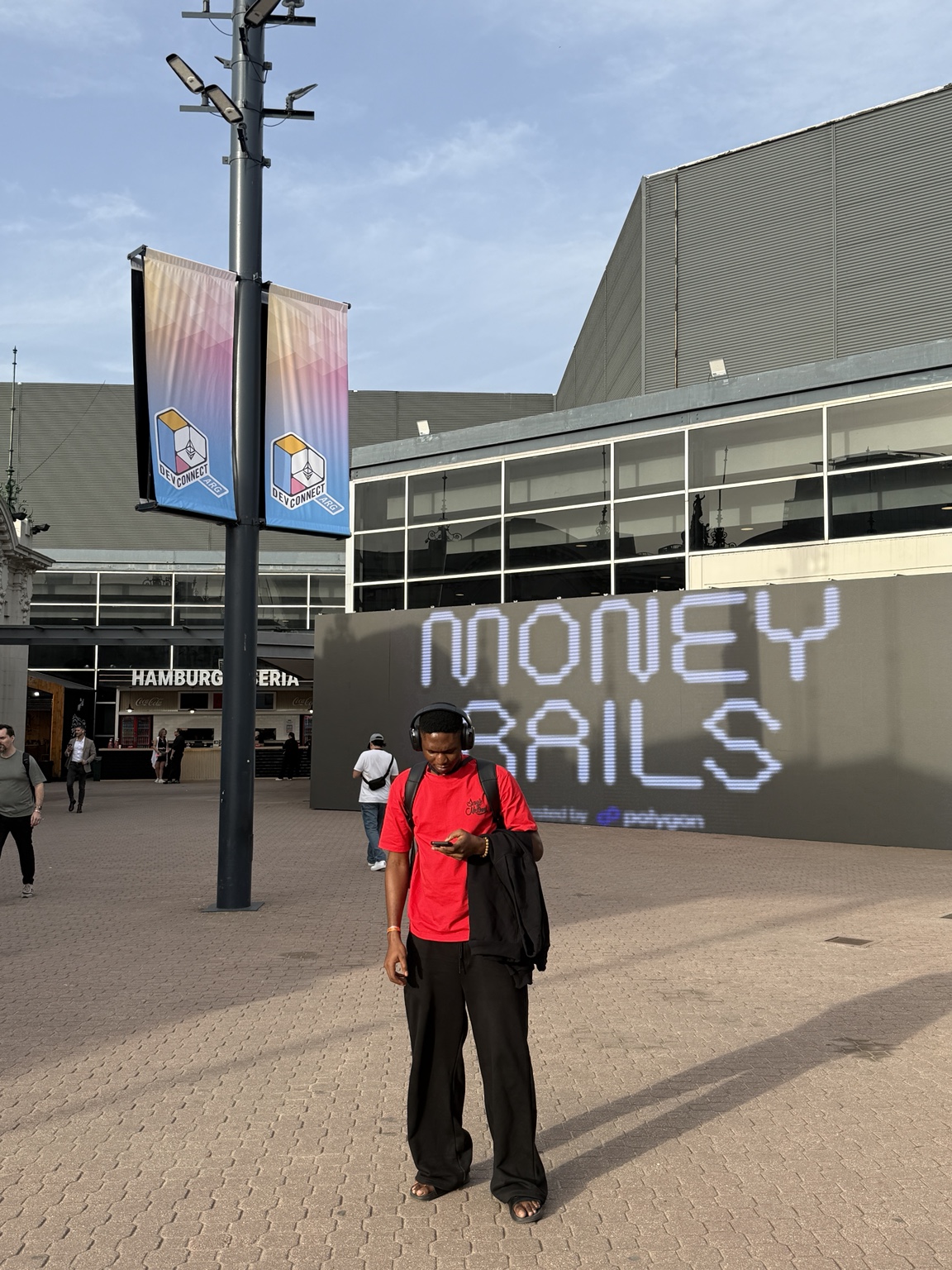 Samuel Dahunsi at the Money Rails payments space during Devconnect Argentina
