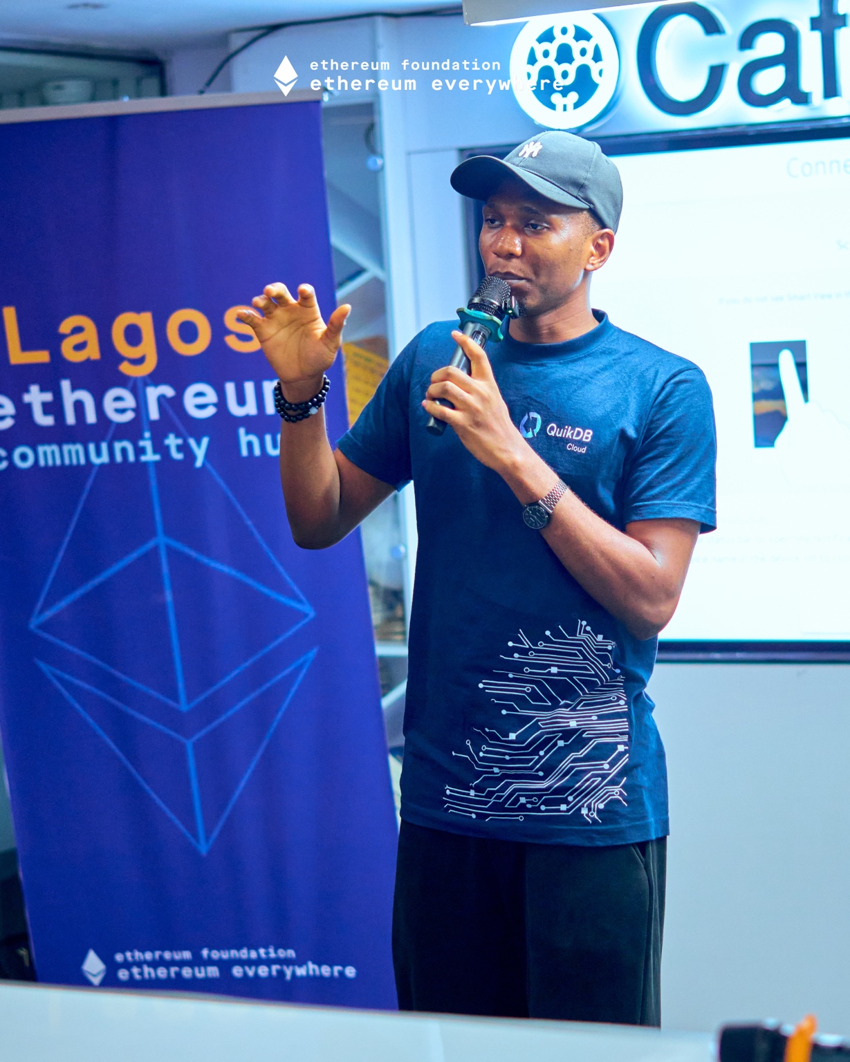 Samuel Dahunsi speaking beside the Lagos Ethereum Community Hub banner