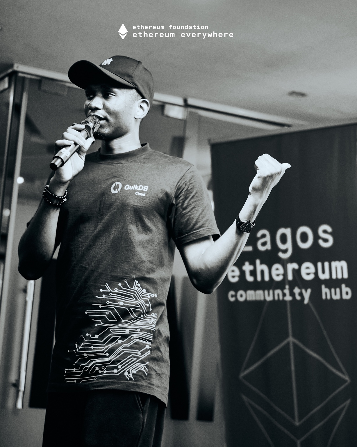 Black-and-white photograph of Samuel Dahunsi speaking at the Lagos Ethereum Community Hub
