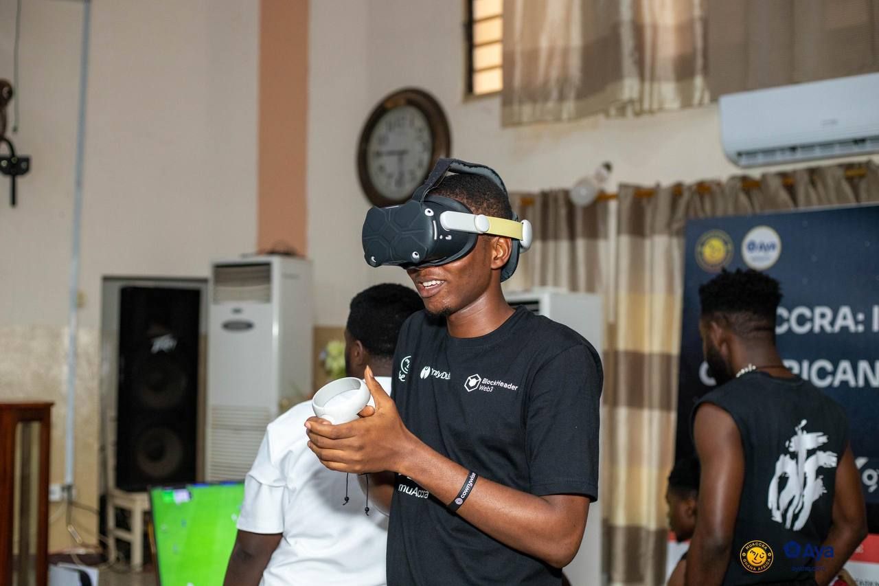 Samuel Dahunsi trying an immersive technology demonstration at muAccra