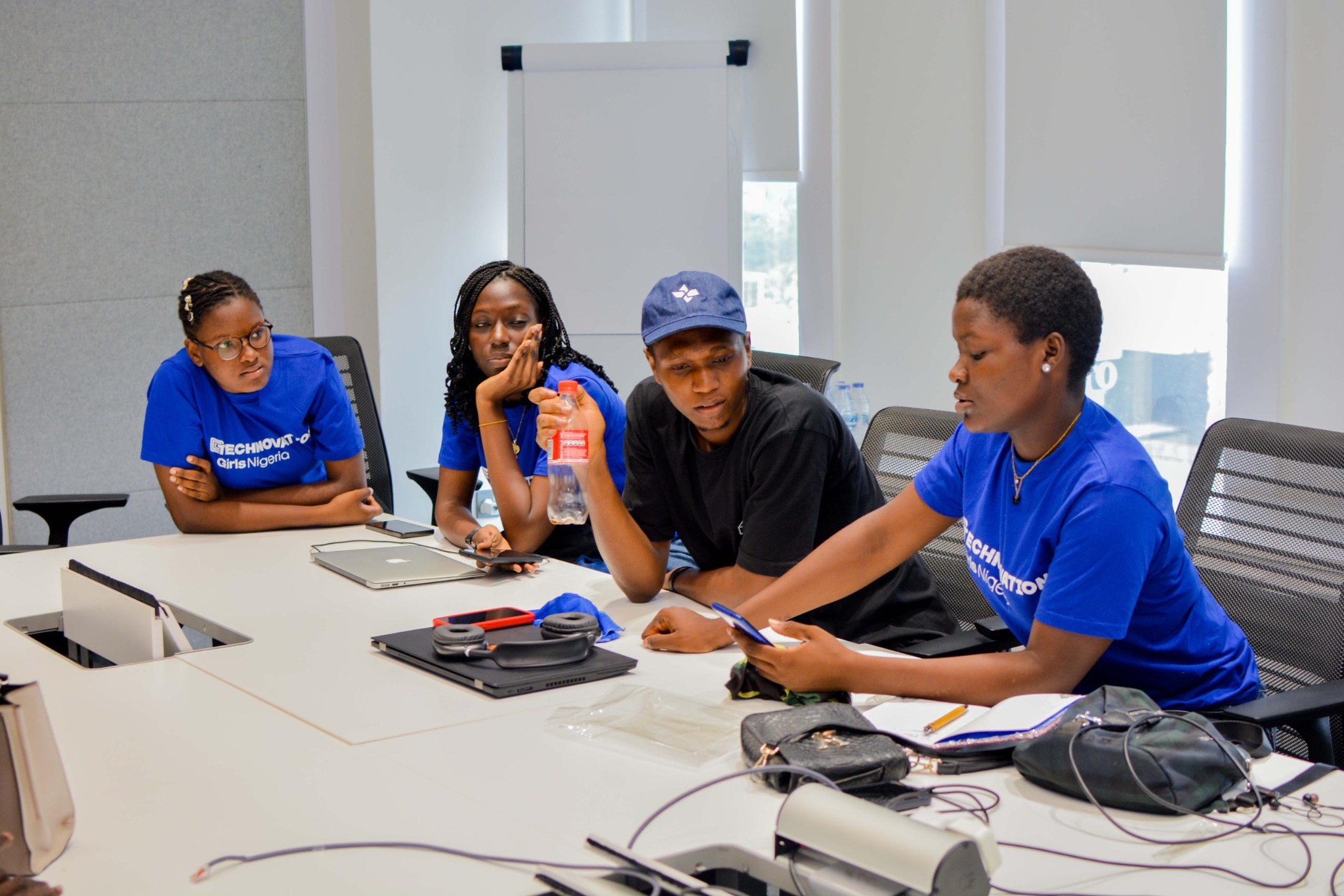 Samuel Dahunsi mentoring a Technovation Girls team during a collaborative product session in Nigeria
