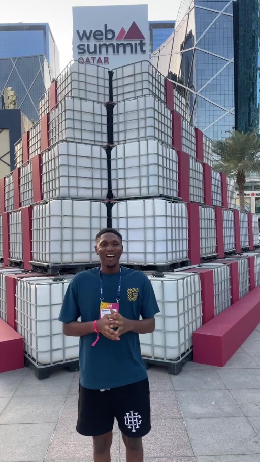 Samuel Dahunsi wearing an Alpha badge at Web Summit Qatar 2026 in Doha